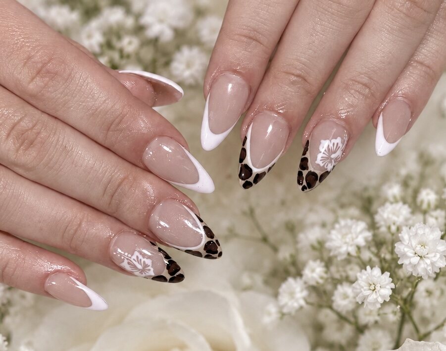 French manicure with animal-print and floral nail art by Vivid Nails & Spa