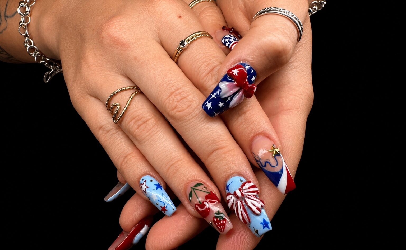Detailed red, white, and blue 3D nail art by Vivid Nails & Spa