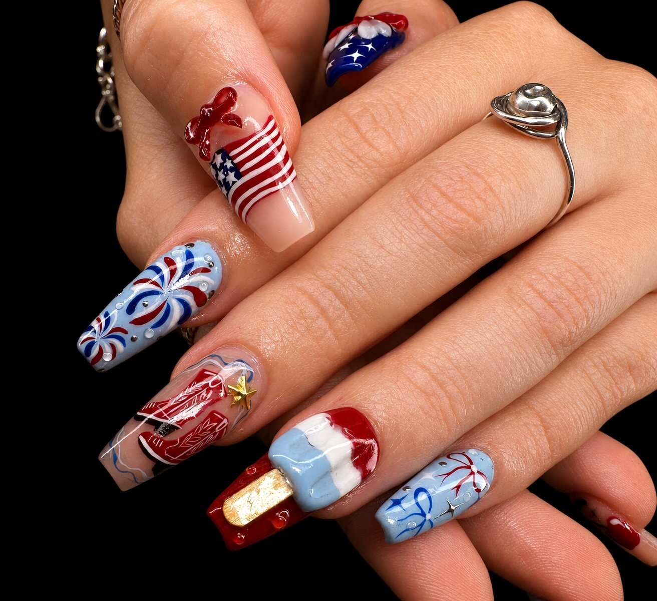 Red, white, and blue custom nail set by Vivid Nails & Spa
